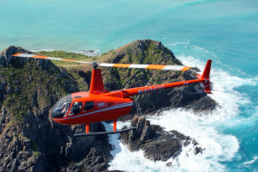 Robinson R66 over ocean