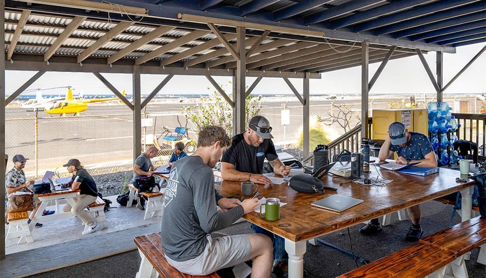 Several students relaxing at an airport.